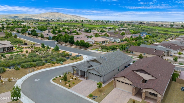 birds eye view of property with a mountain view