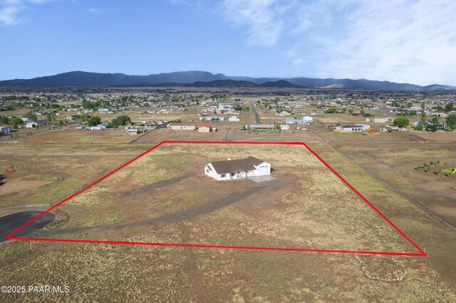 6881 E Bourbon Way, Prescott Valley, AZ 86315 - aerial view of property and surrounding area with property parcel outlined and a mountain backdrop