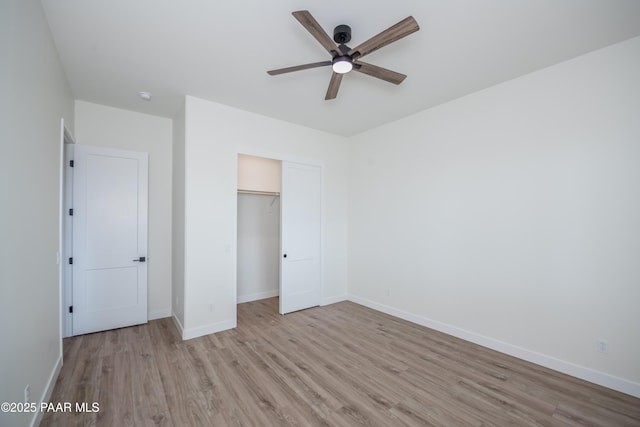 6881 E Bourbon Way, Prescott Valley, AZ 86315 - unfurnished bedroom with light wood finished floors, a closet, and a ceiling fan