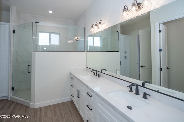 6881 E Bourbon Way, Prescott Valley, AZ 86315 - full bath with wood finished floors, double vanity, a marble finish shower, and recessed lighting