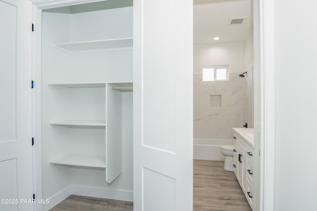 6881 E Bourbon Way, Prescott Valley, AZ 86315 - full bath featuring wood finished floors, vanity, and bathing tub / shower combination