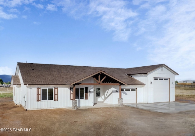 6881 E Bourbon Way, Prescott Valley, AZ 86315 - modern farmhouse style home featuring board and batten siding, a shingled roof, concrete driveway, and an attached garage