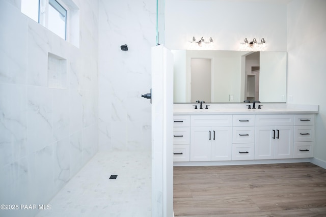 6881 E Bourbon Way, Prescott Valley, AZ 86315 - full bathroom with double vanity, wood finished floors, and a tile shower