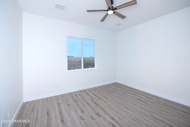 6881 E Bourbon Way, Prescott Valley, AZ 86315 - spare room featuring wood finished floors and a ceiling fan