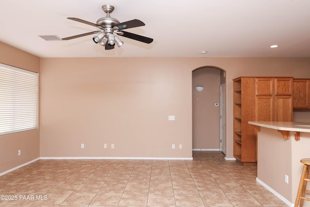 6265 E Distant View Ct, Cornville, AZ 86325 - unfurnished living room featuring arched walkways, a ceiling fan, recessed lighting, and light tile patterned floors