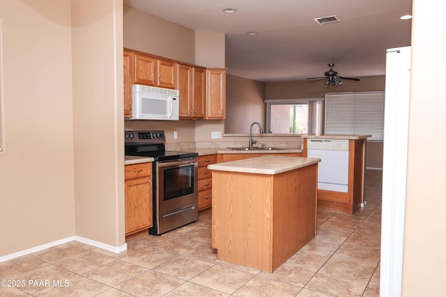 6265 E Distant View Ct, Cornville, AZ 86325 - kitchen featuring white appliances, light countertops, a center island, ceiling fan, and a peninsula