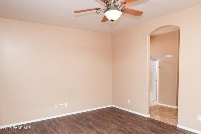 6265 E Distant View Ct, Cornville, AZ 86325 - empty room featuring dark wood finished floors, ceiling fan, and arched walkways