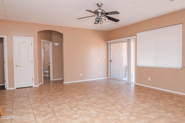 6265 E Distant View Ct, Cornville, AZ 86325 - unfurnished room with arched walkways, ceiling fan, and light tile patterned flooring