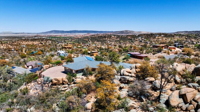 birds eye view of property featuring a mountain view