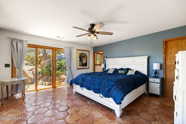 bedroom with access to exterior, visible vents, and ceiling fan