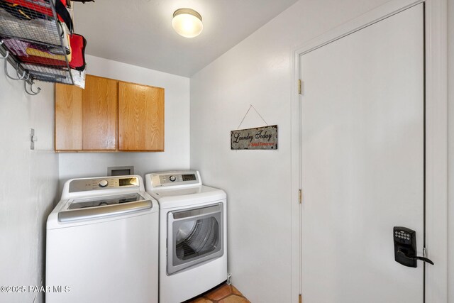laundry area with washer and dryer and cabinet space