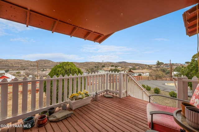 wooden deck featuring a mountain view