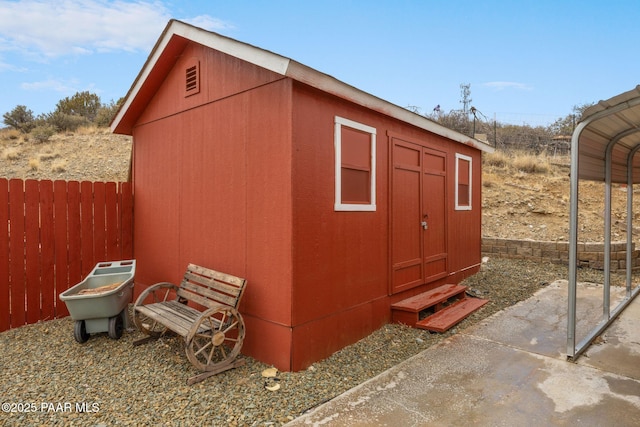 view of shed with fence