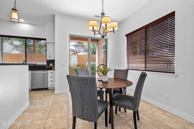 dining area featuring visible vents, baseboards, a notable chandelier, and light tile patterned flooring