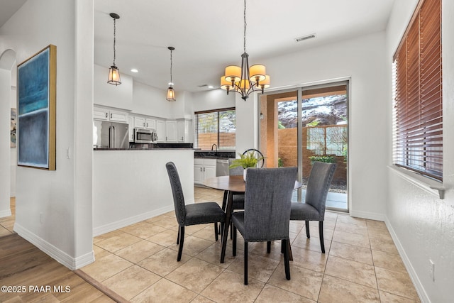 dining space featuring an inviting chandelier, light tile patterned floors, visible vents, recessed lighting, and baseboards