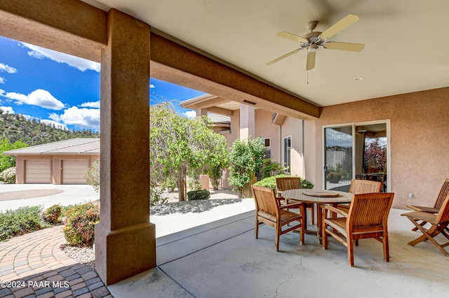 view of patio featuring ceiling fan