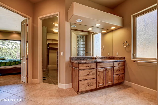 bathroom featuring tile patterned floors and vanity