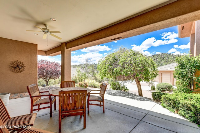 view of patio featuring ceiling fan