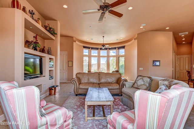 living room featuring ceiling fan and light tile patterned flooring