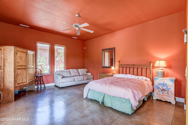 bedroom featuring ceiling fan and concrete flooring