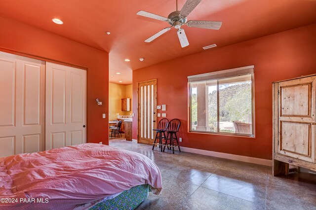 bedroom featuring ceiling fan and a closet