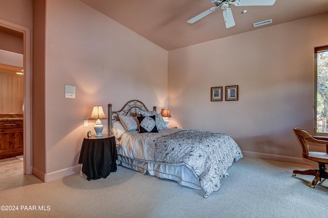 carpeted bedroom featuring ceiling fan and vaulted ceiling