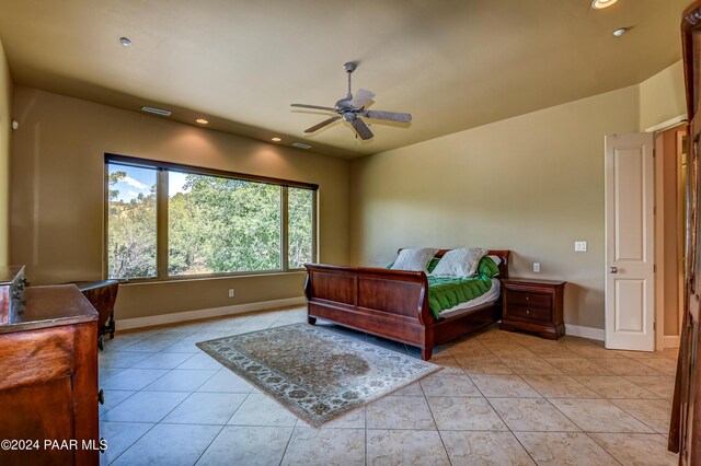 bedroom featuring ceiling fan and light tile patterned flooring