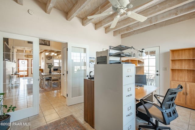 office space with light tile patterned floors, beamed ceiling, plenty of natural light, and ceiling fan with notable chandelier