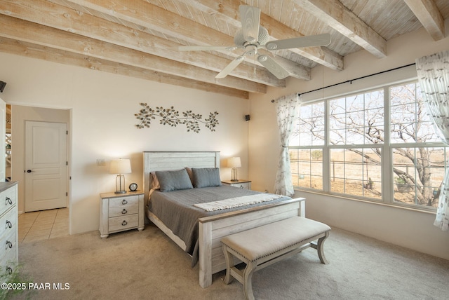 bedroom featuring wooden ceiling, beamed ceiling, light tile patterned floors, and light carpet