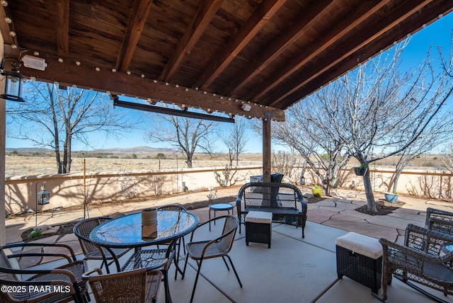 view of patio featuring outdoor dining space and a fenced backyard