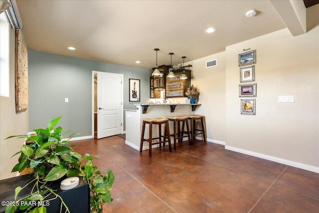 3000 Noble Star Dr, Prescott, AZ 86301 - kitchen featuring a peninsula, visible vents, a kitchen bar, and baseboards