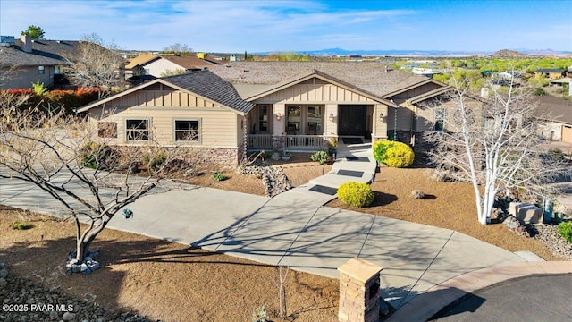 3000 Noble Star Dr, Prescott, AZ 86301 - craftsman-style house with board and batten siding, a porch, and stone siding
