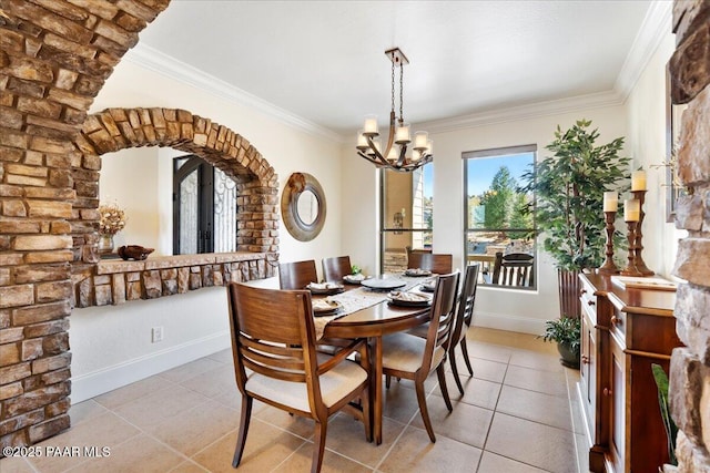 3000 Noble Star Dr, Prescott, AZ 86301 - dining space featuring light tile patterned floors, baseboards, arched walkways, a notable chandelier, and ornamental molding