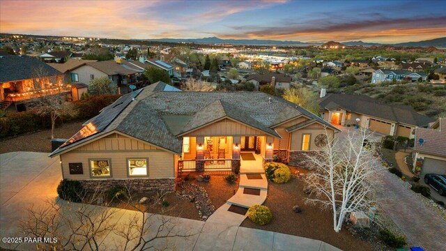 3000 Noble Star Dr, Prescott, AZ 86301 - view of front facade with board and batten siding, covered porch, stone siding, and a residential view