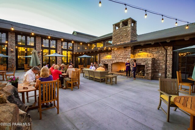 1716 Alpine Meadows Ln Unit 1402, Prescott, AZ 86303 - view of patio / terrace with an outdoor living space with a fireplace