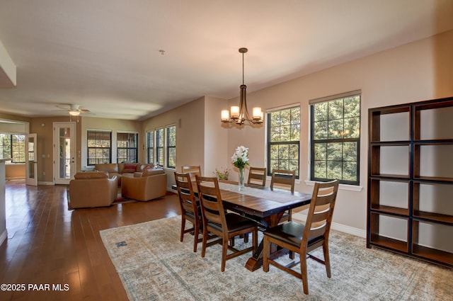 1716 Alpine Meadows Ln Unit 1402, Prescott, AZ 86303 - dining area with a chandelier, hardwood / wood-style flooring, healthy amount of natural light, and baseboards