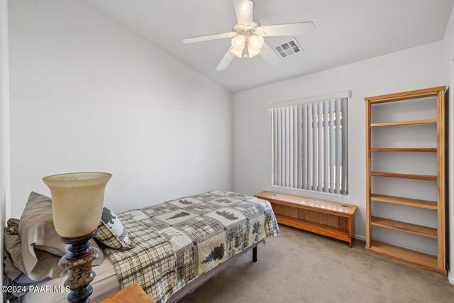 bedroom with light carpet, ceiling fan, and lofted ceiling