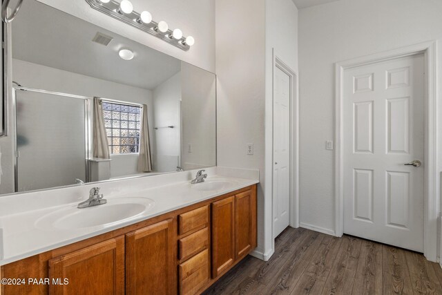 bathroom featuring vanity and wood-type flooring