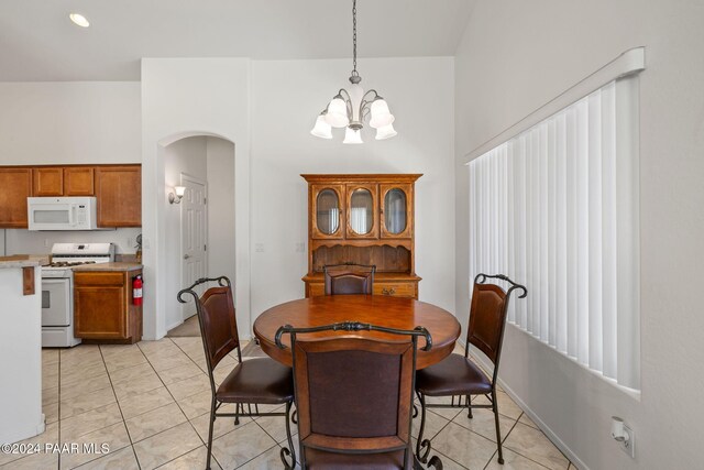 dining space featuring a notable chandelier