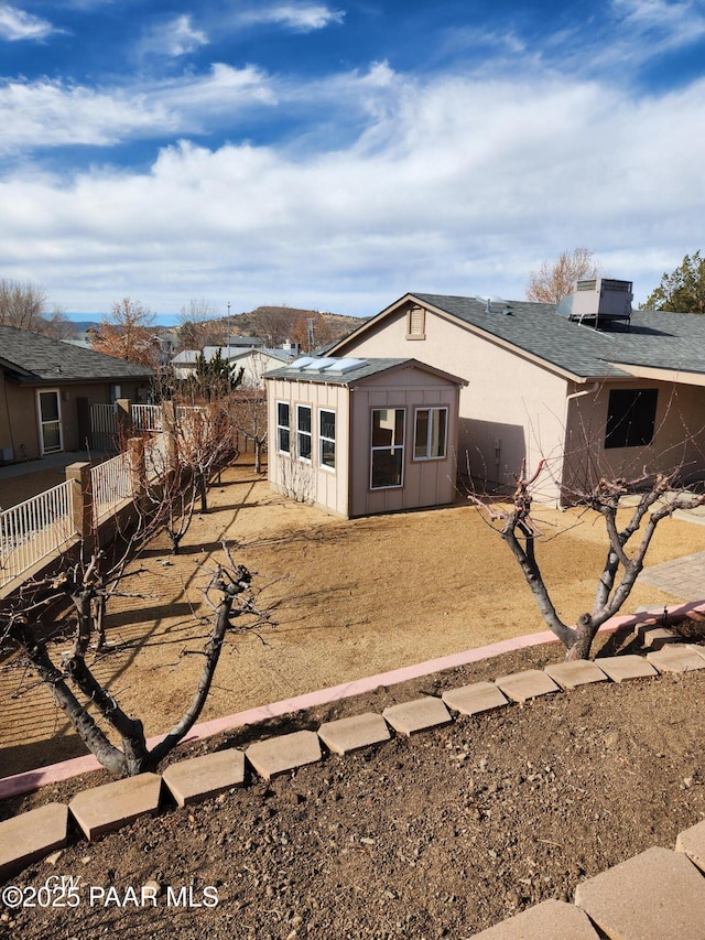 back of property with cooling unit