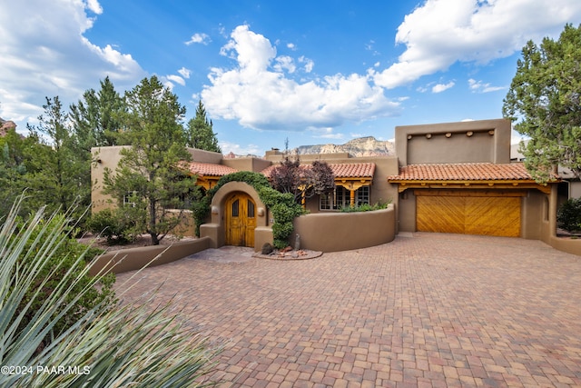 pueblo-style house featuring a mountain view