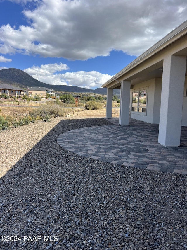 view of yard with a patio area and a mountain view