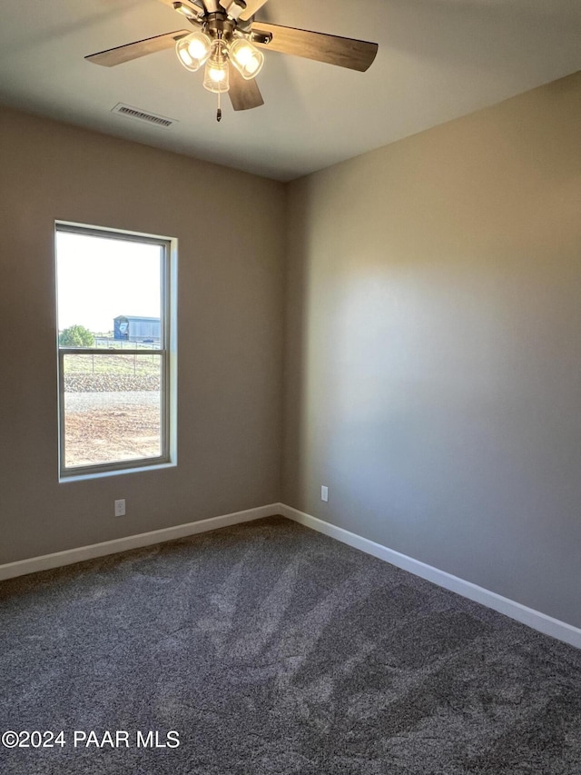 unfurnished room with ceiling fan and carpet floors