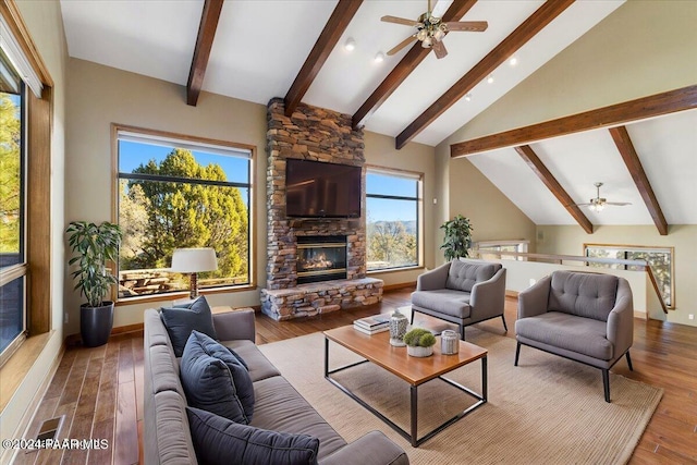 living room with beam ceiling, ceiling fan, high vaulted ceiling, a fireplace, and hardwood / wood-style flooring