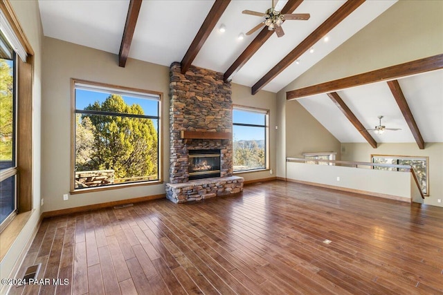 unfurnished living room with a fireplace, a wealth of natural light, hardwood / wood-style floors, and ceiling fan