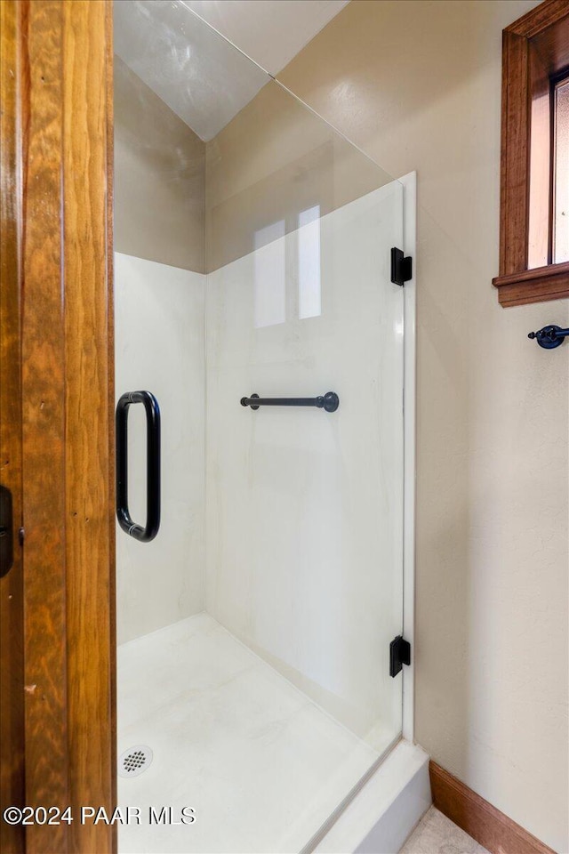 bathroom with an enclosed shower