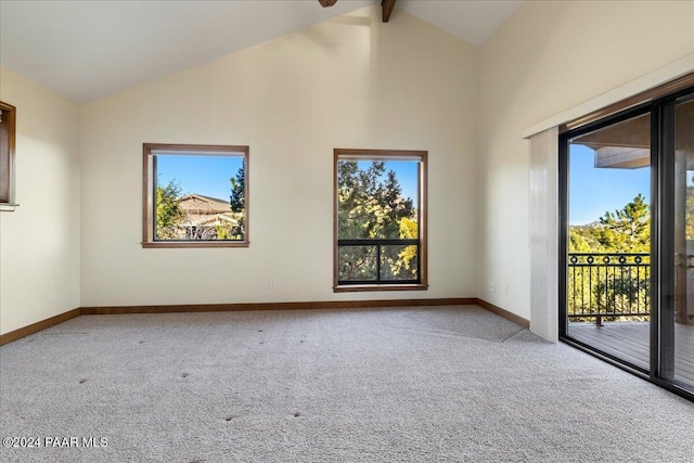 empty room featuring beam ceiling, carpet floors, and high vaulted ceiling