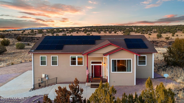 view of front facade with solar panels