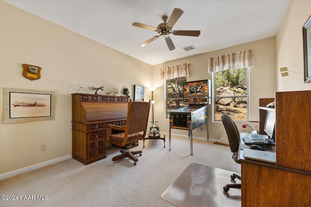 carpeted office featuring ceiling fan