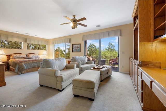 bedroom with light carpet and access to exterior